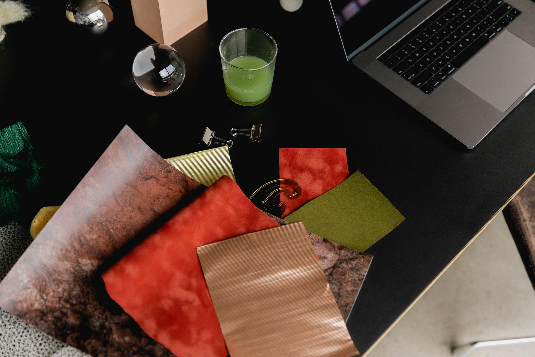 Colored material samples spread across a table