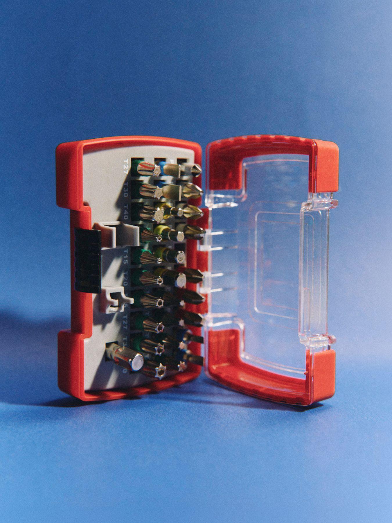 An open case of screwdriver bits on a blue background